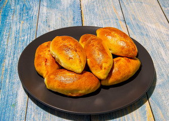 Pies with stewed cabbage and carrots baked in the oven