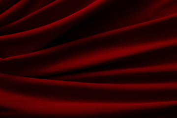 waves of red satin fabric as background