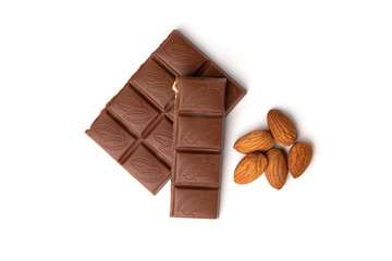  Milk chocolate with nuts isolated on white background.
