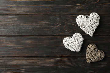 Hearts on rustic wooden background, space for text