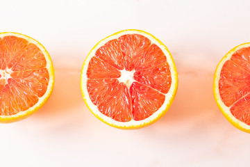 orange slices of grapefruit isolated on white background
