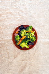 Mixture of vegetables cooked with broccoli and black mushrooms served in a plate for eating