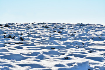 plowed land covered with snow