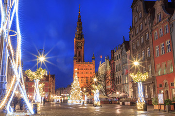 Fototapeta na wymiar Gdansk New Year Square with Christmas tree and town hall at sunrise