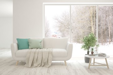 Stylish room in white color with sofa and winter landscape in window. Scandinavian interior design. 3D illustration