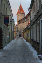 Narrow street in Old Town Tallinn in winter. Estonia