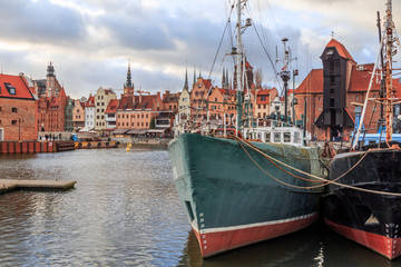 Fototapeta na wymiar Gdansk city promenade in poland with beautiful old buildings and ships in winter