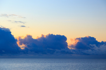 Bright cumulus clouds against the blue sky. Sunset sky Natural background. seascape