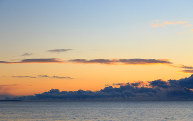 Bright cumulus clouds against the blue sky. Sunset sky Natural background. seascape