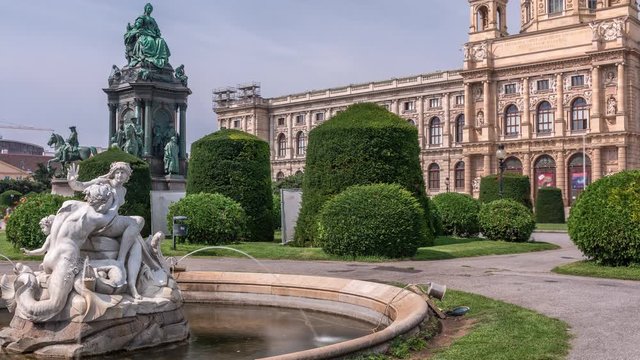 Empress Maria Theresia Monument timelapse and Art History Museum with fountain on foreground in Vienna, Austria. Beautiful view of famous Naturhistorisches Museum (Natural History Museum) with park