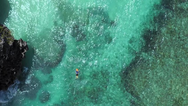 alone man on the surfboards at Bali, Indonesia, 4k