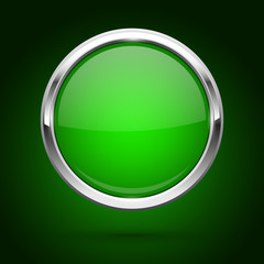 Green glass button with metal frame. Round icon on dark background