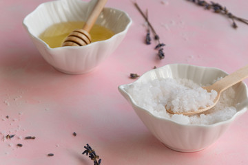 Natural wellness beauty ingredients on pink background. Health care spa therapy with honey, sea salt and lavender,  super food for the skin. Space for text