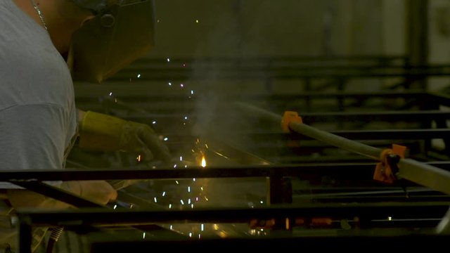 357 Welder working in a factory in slow motion