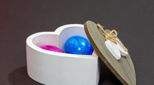 white wooden bowl with buten Easter eggs