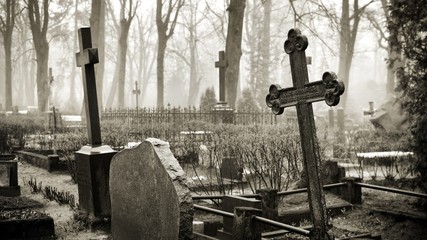 cross in fog at the cemetery