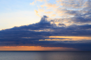 Obraz na płótnie Canvas Bright cumulus clouds against the blue sky. Sunset sky Natural background. seascape