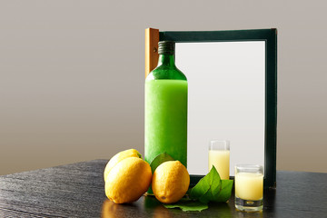 Bottle of lemoncello with glasses and order menu