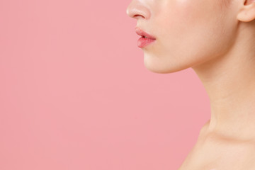 Close up cropped blonde half naked woman 20s perfect skin lips nude make up isolated on pastel pink wall background studio portrait. Skin care healthcare cosmetic procedures concept Mock up copy space