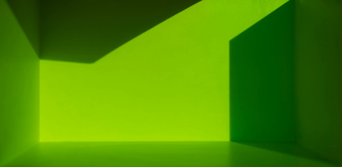Refraction of light and bright green shadows in an empty room