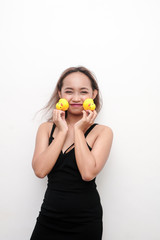 Young girl holding rubber duck in celebration of National Rubber duck day.