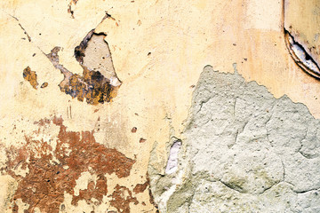 Old wall with peeling paint. Rough vintage background