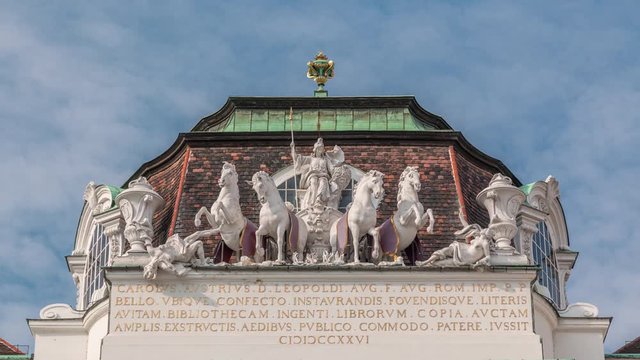Sculptures at The Austrian National Library entrance timelapse, Josefsplatz, Vienna, Austria. Blue cloudy sky