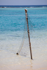 Fishing net on a tropical beach background