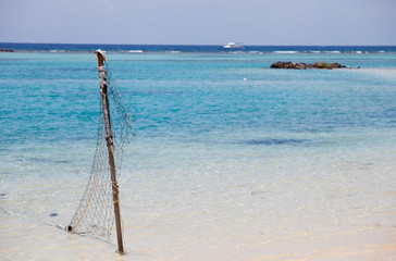 Fishing net on a tropical beach background