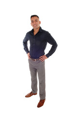 Fototapeta premium Young man standing with his hands on his hips