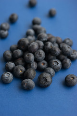 Blueberry berry on a classic blue background.