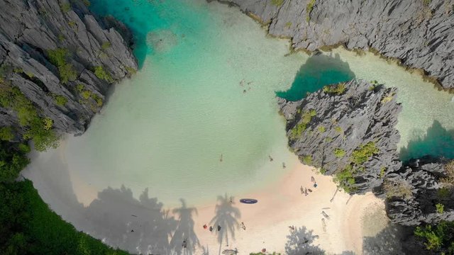 Aerial drone view of Hidden beach on Matinloc Island in El Nido, Palawan, Philippines - Tour C route - Paradise lagoon in tropical scenery