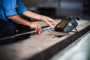 UT, Ultrasonic testing to detect imperfection or defect in welding of steel structure outside. NDT Inspection.