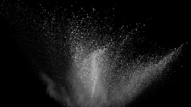 Realistic white powder explosion on black background. Slow motion with acceleration in vertical motion