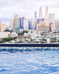 Fototapeta na wymiar rooftop swimming pool with stunning views of the big city. Kuala Lumpur, Malaysia.