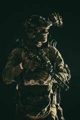Half length, low key portrait of elite commando fighter, professional mercenary hiding identity...