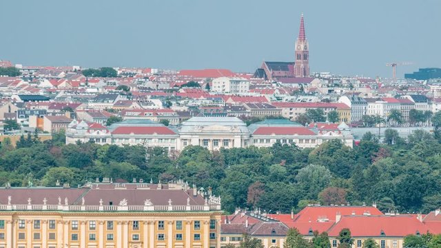 Beautiful view of famous Schonbrunn Palace timelapse with Great Parterre garden and lake in Vienna, Austria. City panorama on a background