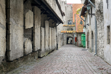 Fototapeta na wymiar Ancient cemetery slabs of old Tallinn