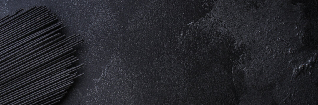 pasta spaghetti with cuttlefish ink (healthy eating, black color) menu concept. food background. top view. copy space