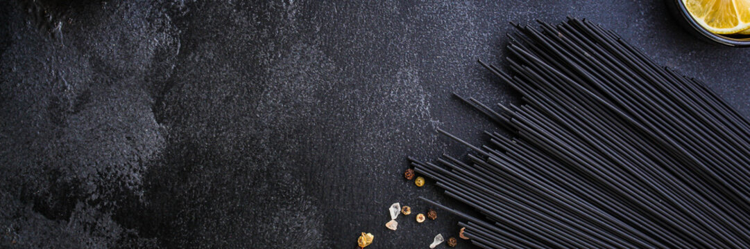pasta spaghetti with cuttlefish ink (healthy eating, black color) menu concept. food background. top view. copy space