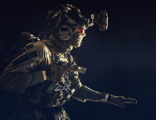 Army special operations soldier, security service fighter, commando shooter equipped modern...