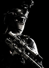 Shoulder portrait of army elite troops sniper, anti-terrorist tactical team marksman wearing helmet...