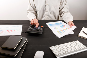 Fototapeta premium Close up of man accountant or banker making calculations.