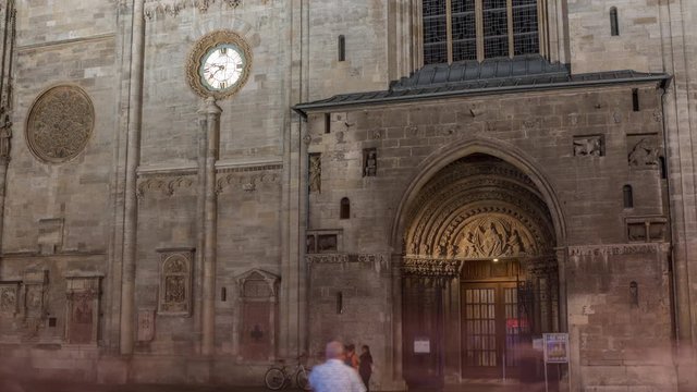 Entrance to St. Stephen's Cathedral night timelapse hyperlapse (Stephansdom, Domkirche St. Stephan), the mother church of Roman Catholic Archdiocese of Vienna and one of the tallest churches in the