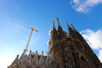 Fototapeta na wymiar view to famous spanish landmark sagrada familia in barcelona spain in the light of winter sun