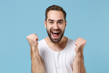 Close up bearded young man 20s years old perfect skin wearing white shirt isolated on blue pastel...
