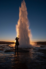 woman standing at Icelandic geysir