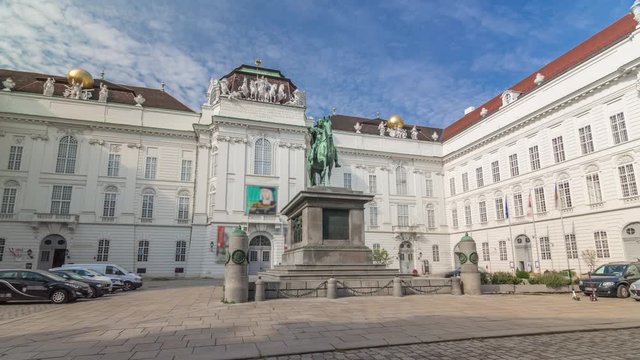 Equestrian statue of Holy Roman Emperor Joseph II riding a horse in Josefsplatz Square timelapse hyperlapse, Hofburg Palace in Vienna, Austria. Austrian National Library on a background