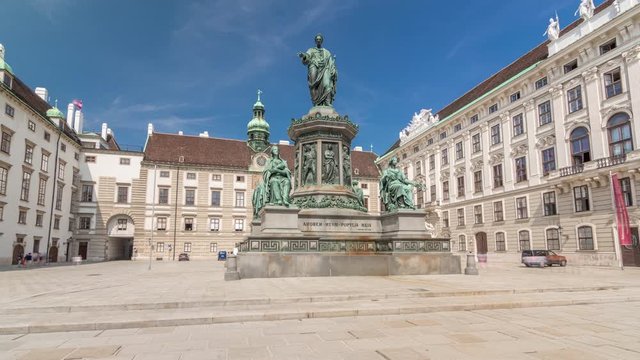 Statue of Kaiser Franz Joseph I timelapse hyperlapse at the Hofburg Palace in Vienna. It is located in the courtyard of Hofburg Palace. Blue sky at sunny day