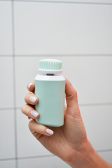 Girl is cleaning face with electric brush. Woman with special brush for deep cleansing facial remove makeup. Skin Care concept. High technology beauty.